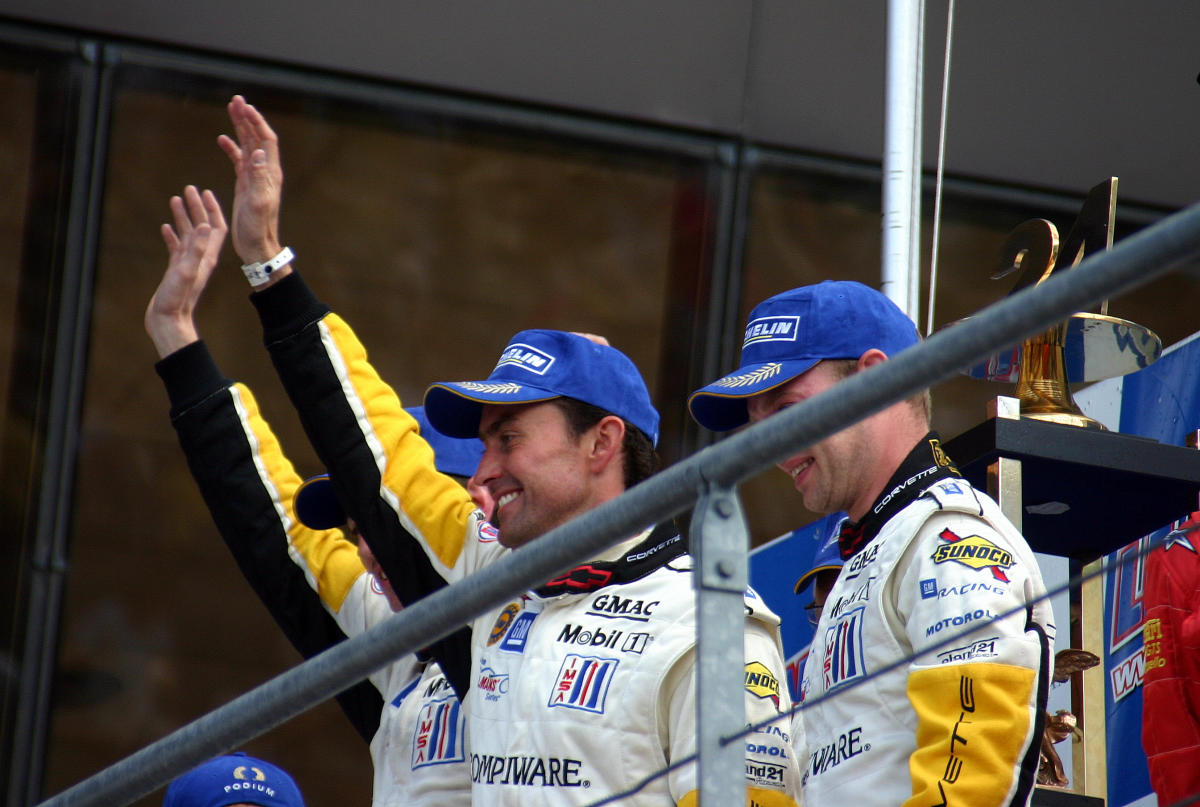 Oliver Gavin, Olivier Bereta & Jan Magnussen celebrate their GTS class win on the podium at the 2004 Le Mans (50883628633).jpg